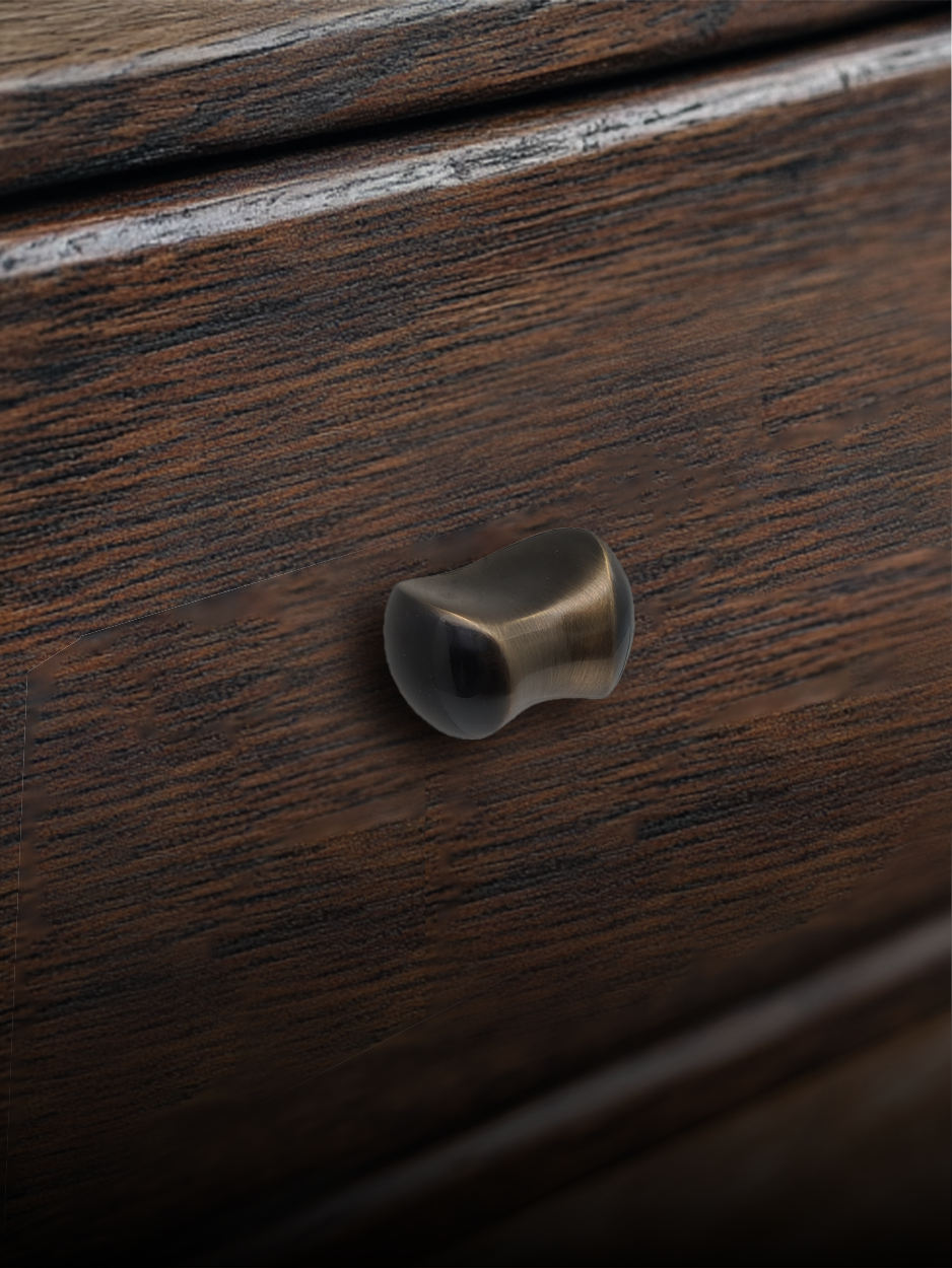 Modern cabinet knobs and drawer pulls in solid brass on wooden cabinet drawers