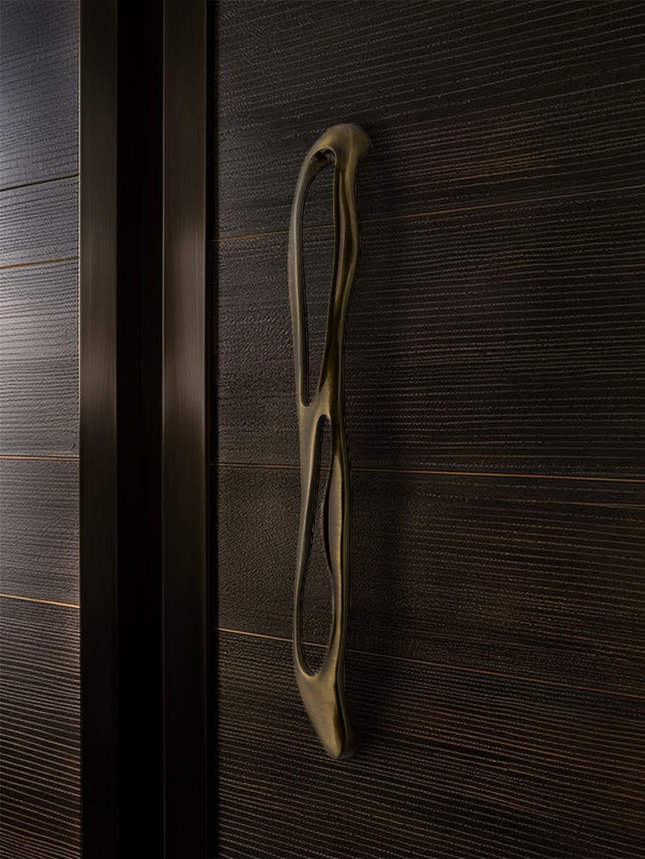 Close-up of a wooden door with a decorative handle