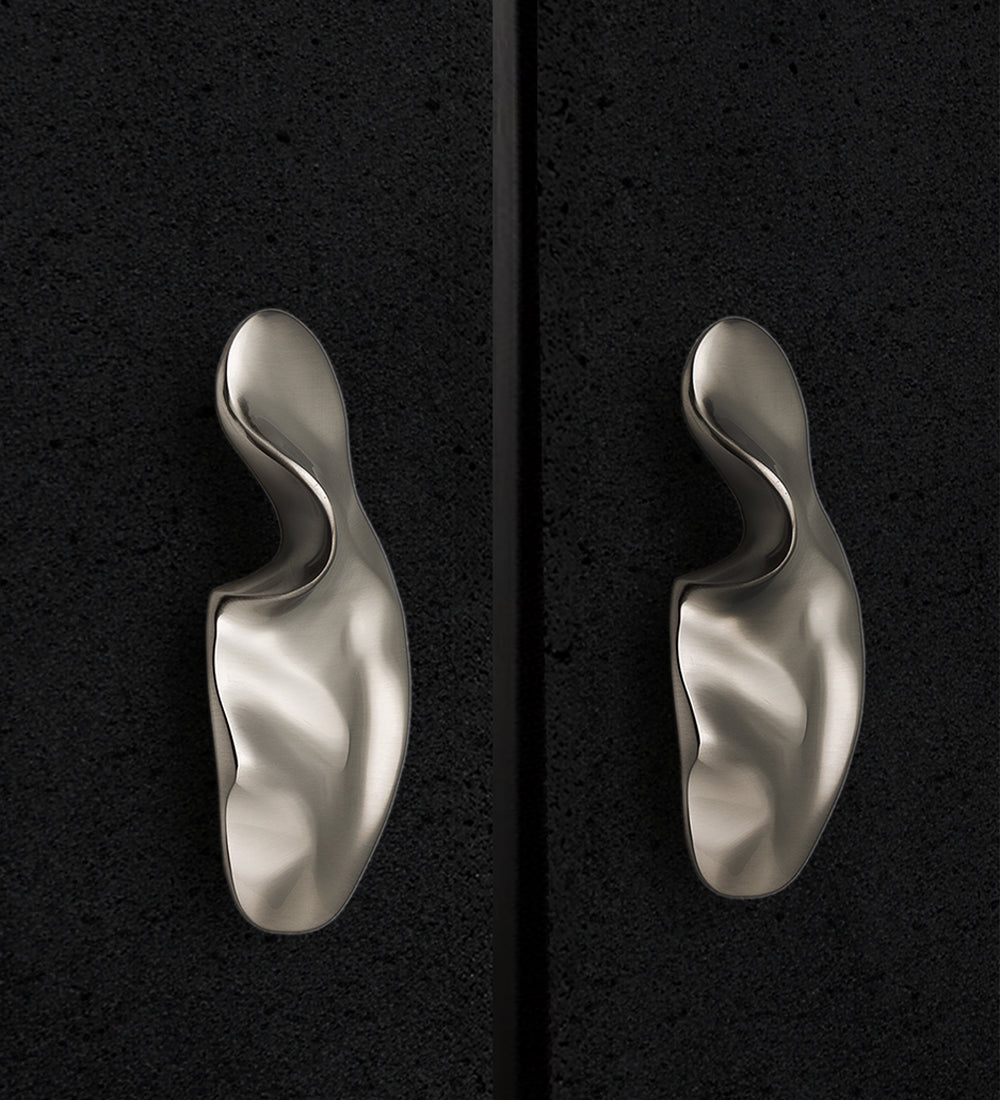 Luxury sculpted hardware in brass for modern homes and interiors