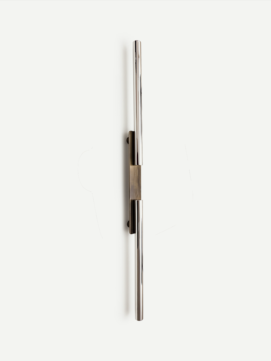 Industrial-style pull handle for urban entry doors in stainless steel.