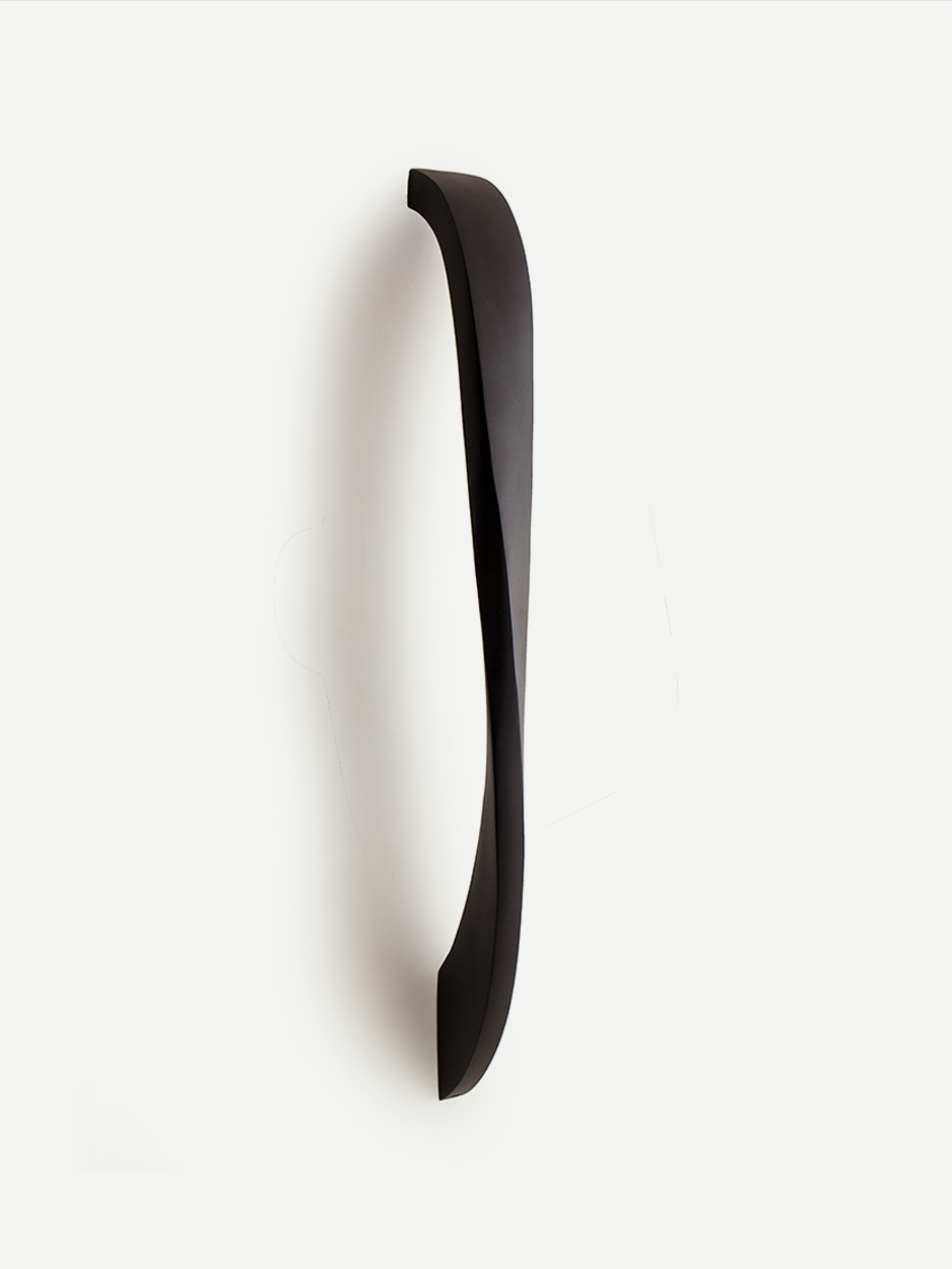 Minimalist brass pull handle for main doors.