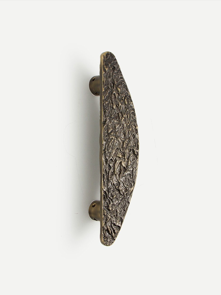 Modern farmhouse entry pull handle in rustic brass bronze finish.