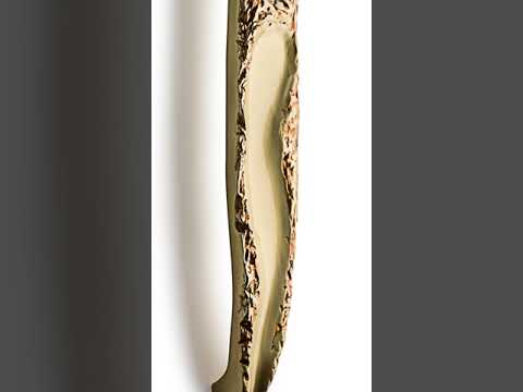 Modern sculpted textured brass pull handle for double front doors.