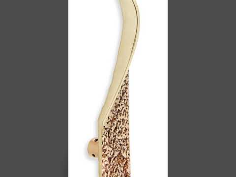 Modern textured brass front door handle.