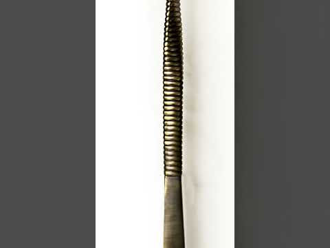 A close-up video showcasing the 48-inch Twirled door handle in glossy bronze, highlighting the intricate twist and geometric design as the camera pans along the handle’s length, capturing its elegance and modern aesthetic.