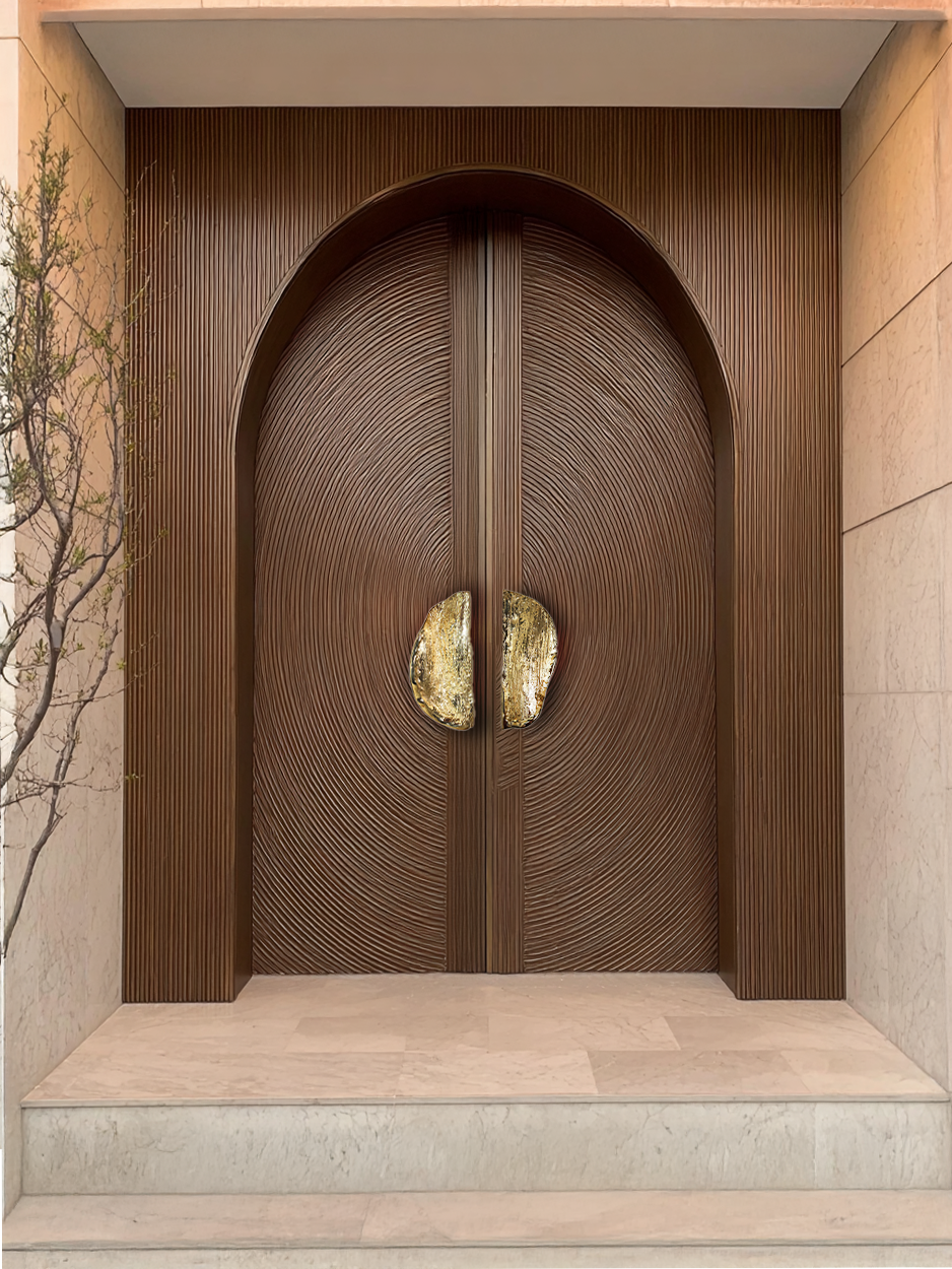 Double leaf luxury door with gold accent d-shaped door handles.