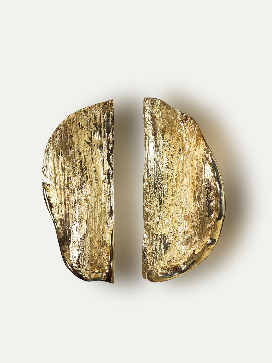 Luxury brass double door handles with abstract folded circle textured design