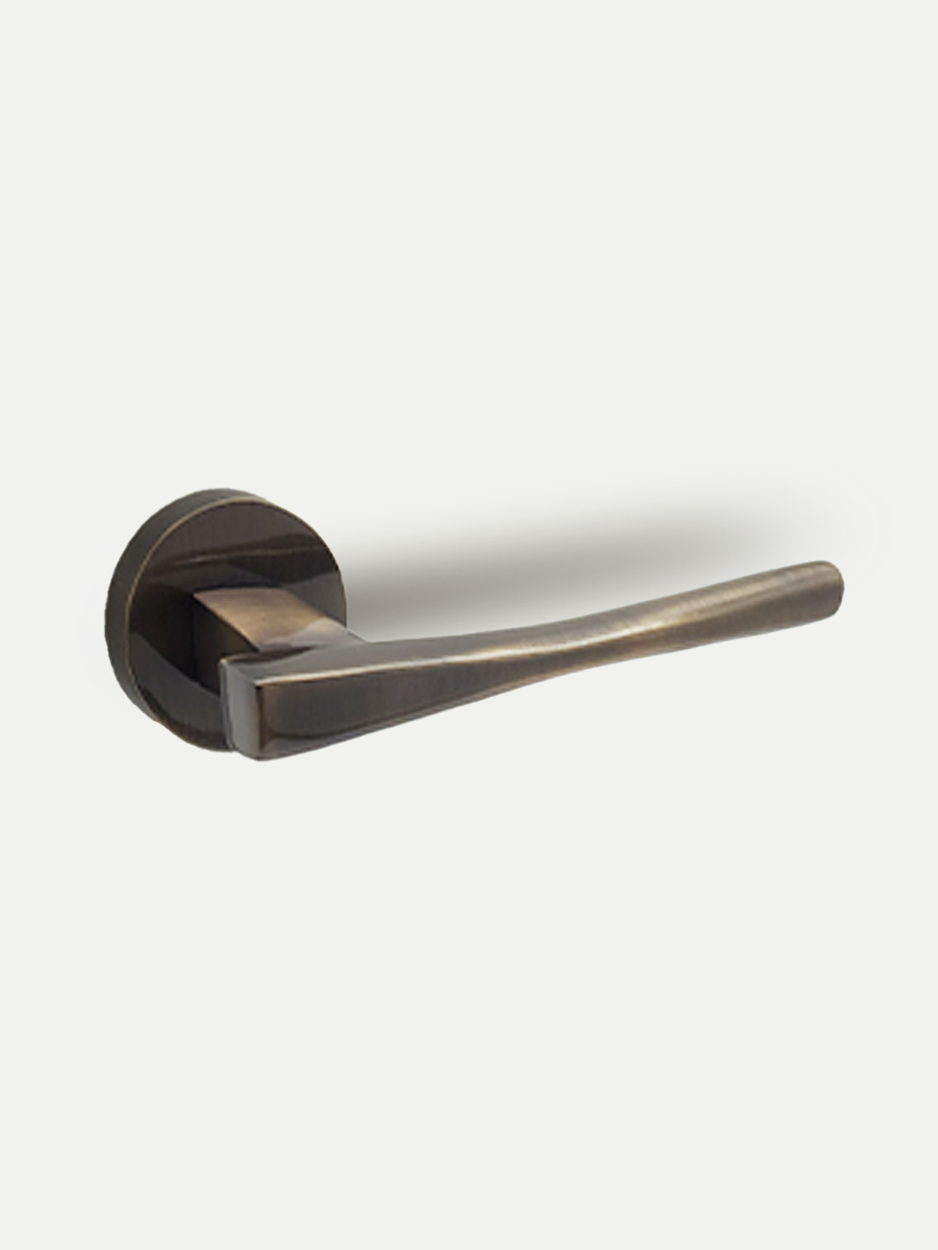 A sleek modern contemporary brass lever handle with a round rose mounting for interior doors - GLITTERS HARDWARE 