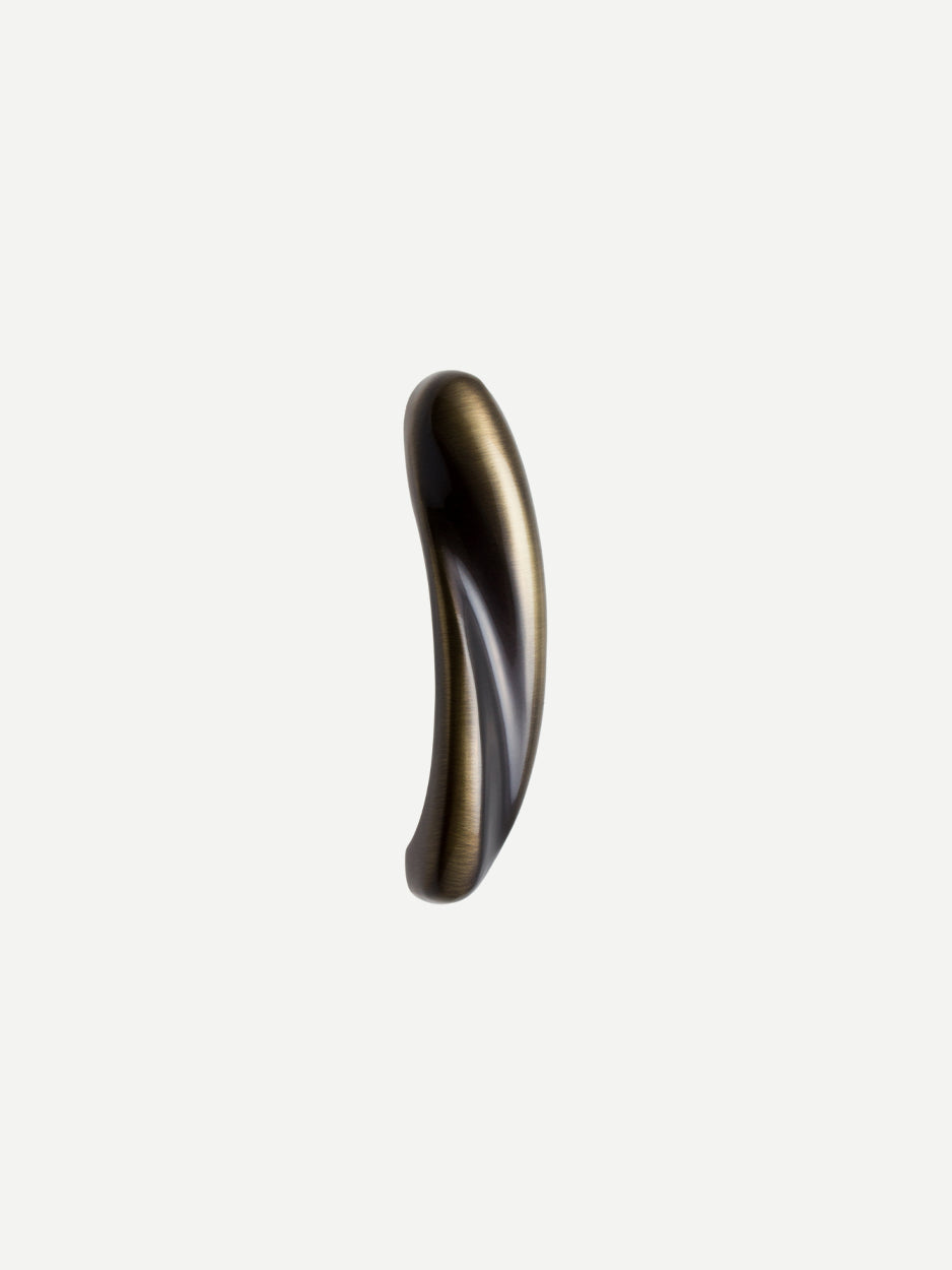 Close-up of the Flare Cabinet Pull in a glossy bronze finish, showcasing its abstract yet elegant design, perfect for adding a modern touch to any dresser or kitchen drawer.