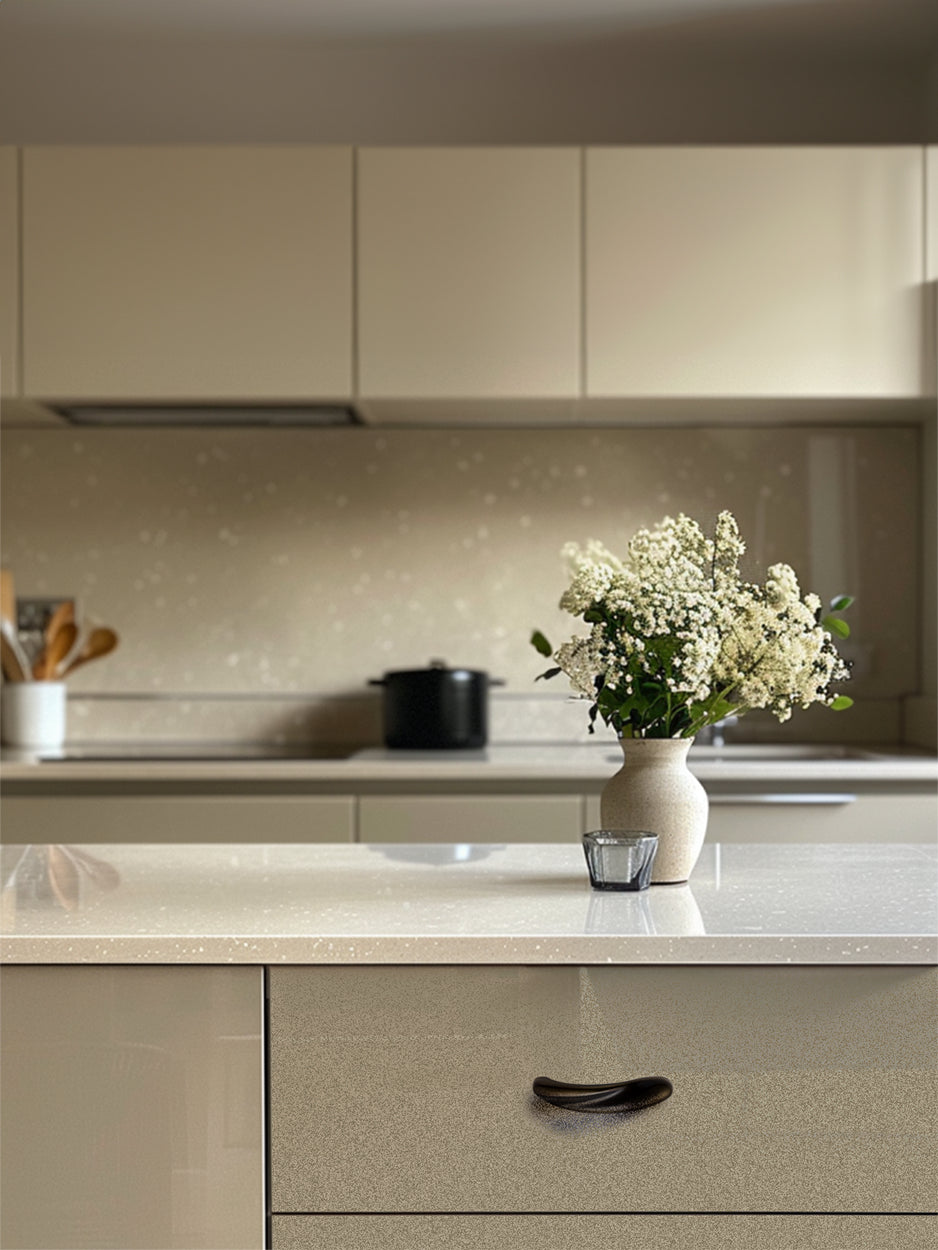 Mockup of the Flare Cabinet Pull mounted on a kitchen drawer, illustrating how its abstract and modern design elevates the aesthetic of any kitchen space.