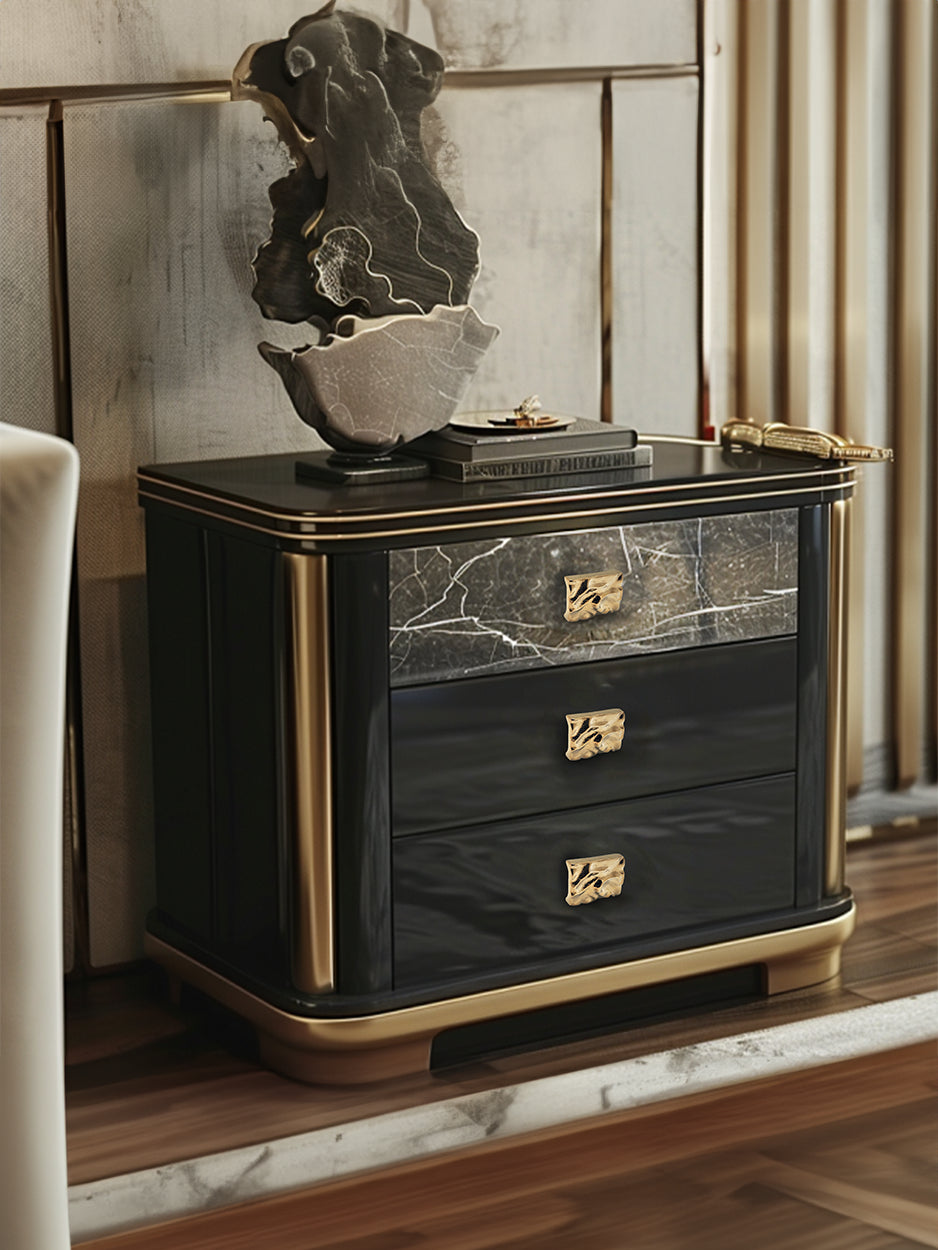 Mockup of the Furl Cabinet Knob mounted on a kitchen cabinet, illustrating how its folded brass design adds a sophisticated and modern flair to any home interior.