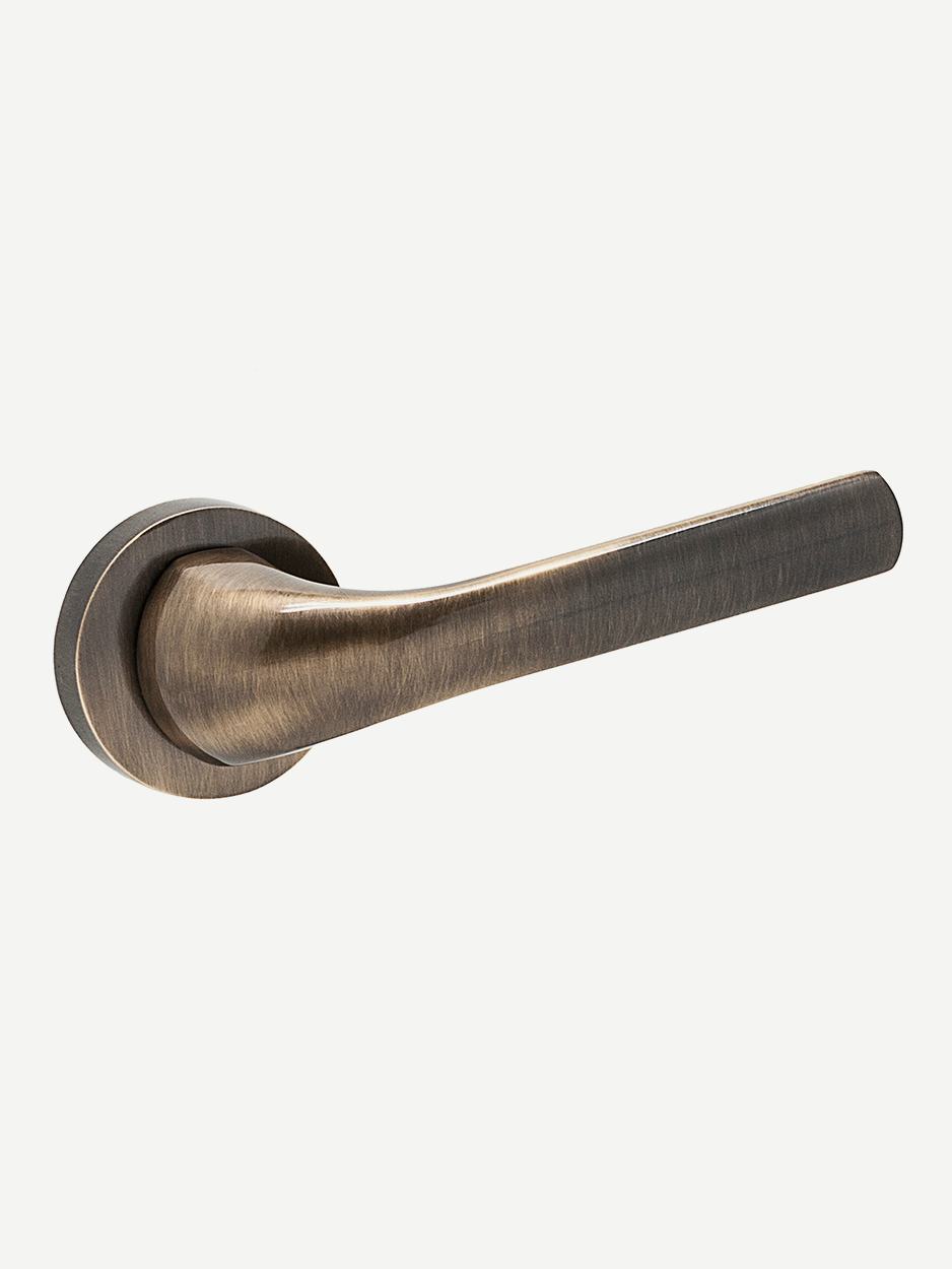 Image of the RODULE Lever Handle in glossy bronze finish. The sleek, modern design seamlessly blends into various décor styles, adding a touch of class and sophistication to any interior door.