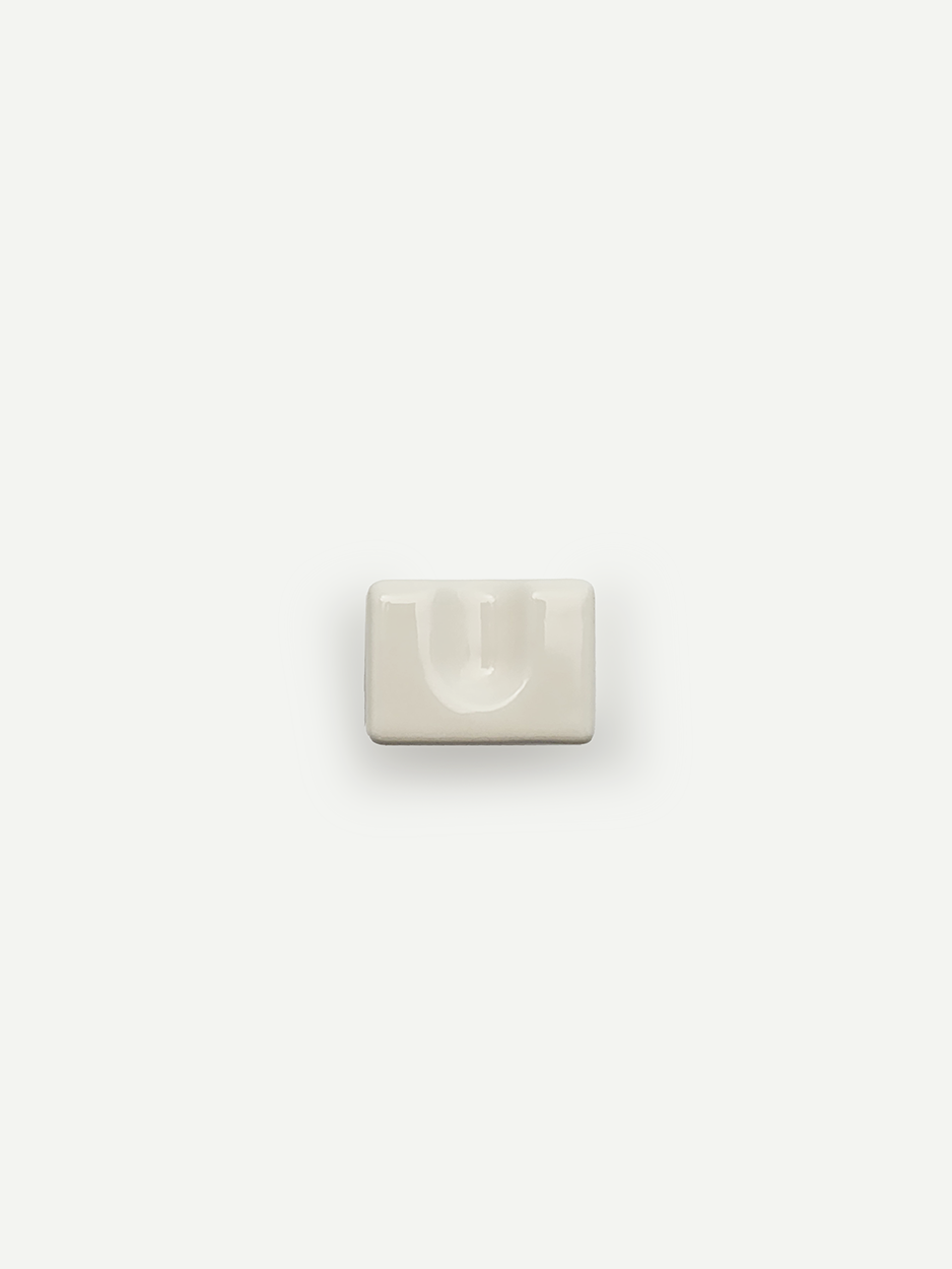 White ceramic knobs for interior designers working on high-end projects.