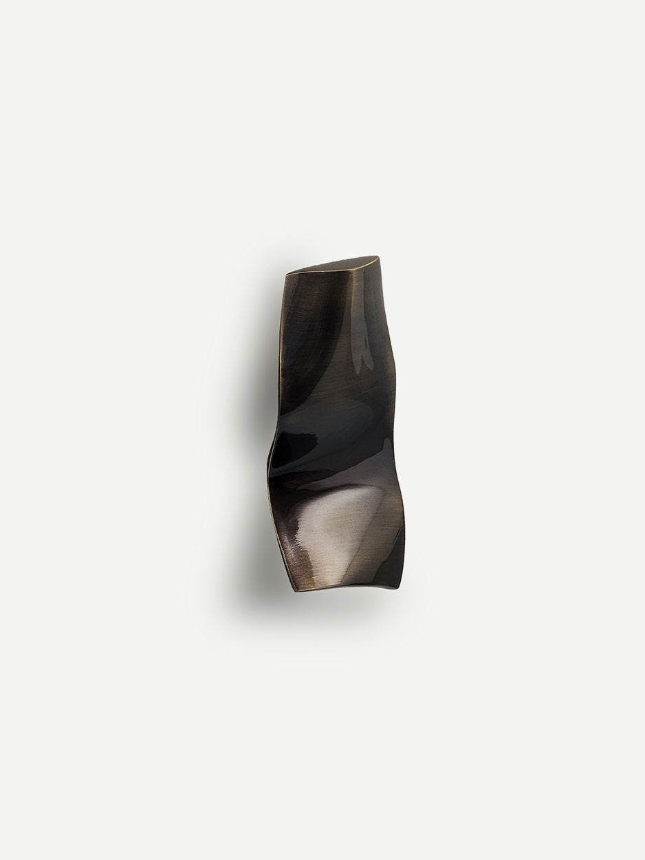 Modern sculpted brass cabinet pulls for custom cabinetry and closets