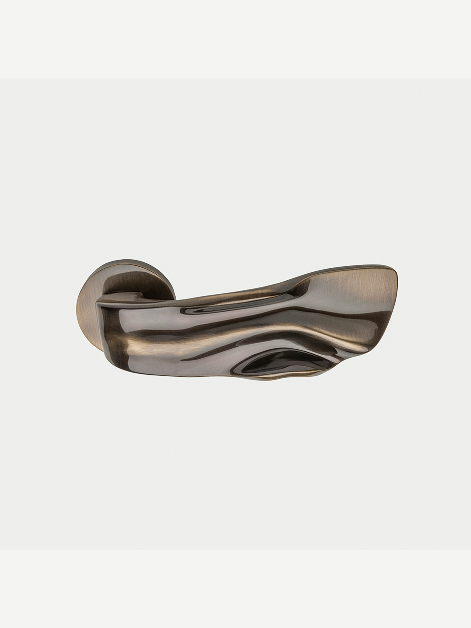 Premium hardware lever handles with luxury sculptural details