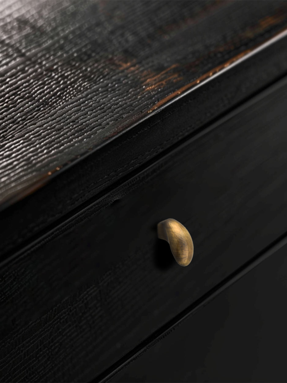 Mockup image of the OVATE knob installed on furniture, demonstrating its sleek and stylish impact in a real-world setting. Keywords: luxury drawer knob mockup, furniture hardware, modern interior design.