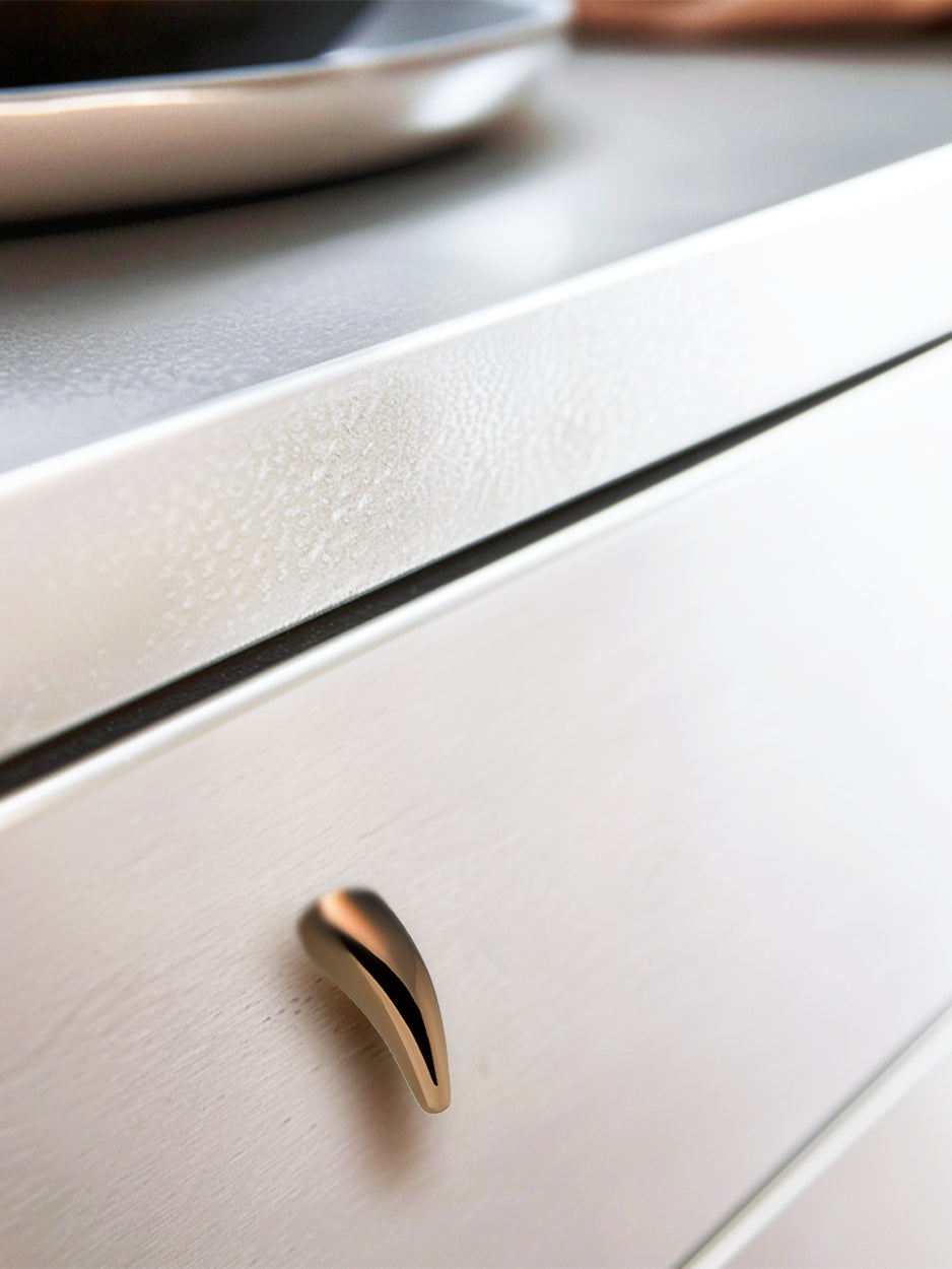 Mockup image of the brass cabinet knob installed on furniture, showcasing its stylish impact and luxurious appeal, perfect for modern interiors, dresser drawers, and kitchen cabinets.