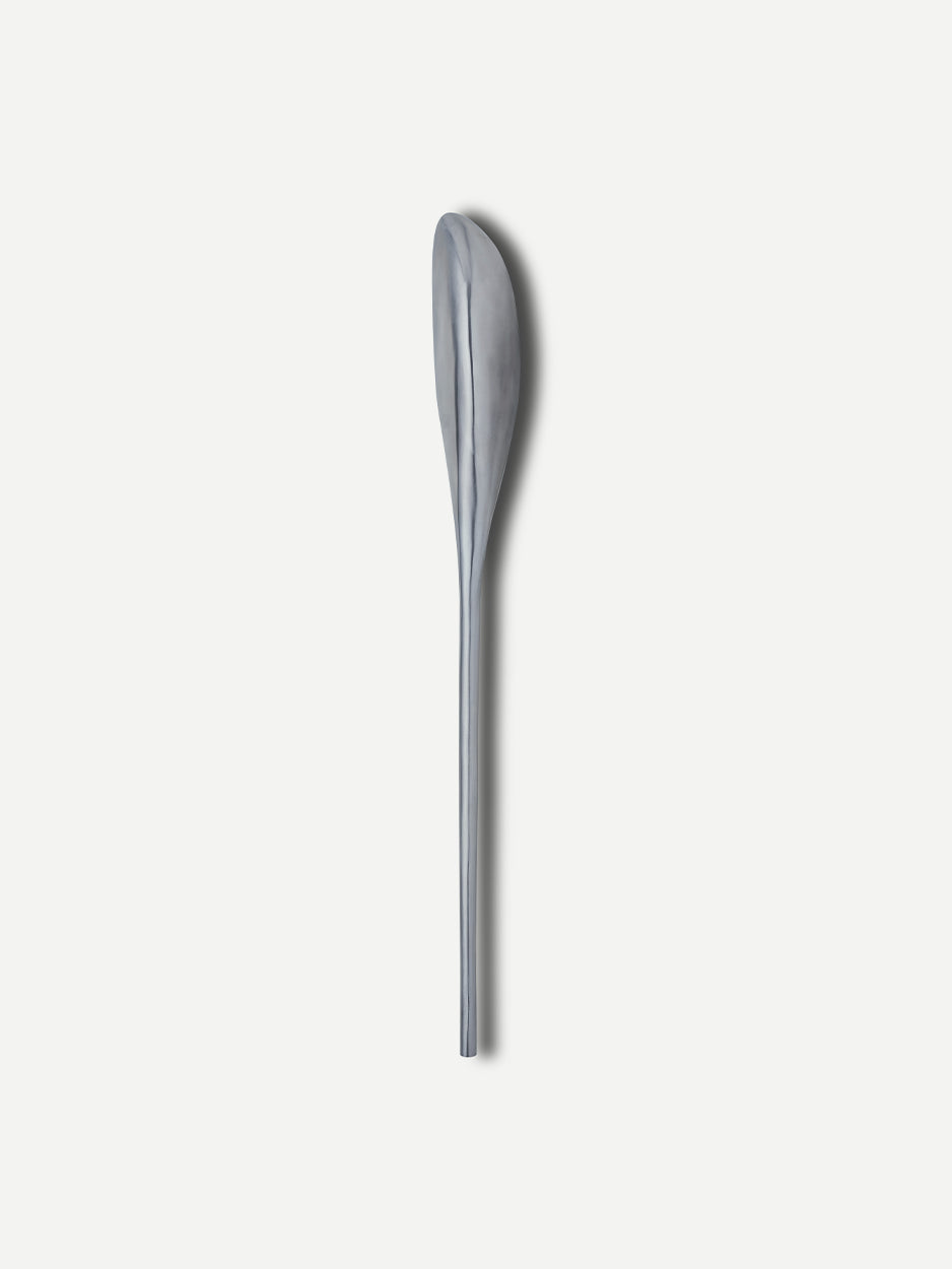 Front view of the Lumen push/pull handle, showcasing its sleek and reflective stainless steel surface. The handle's abstract design captures and reflects light, highlighting its elegant form, perfect for luxury villa and office entrances.