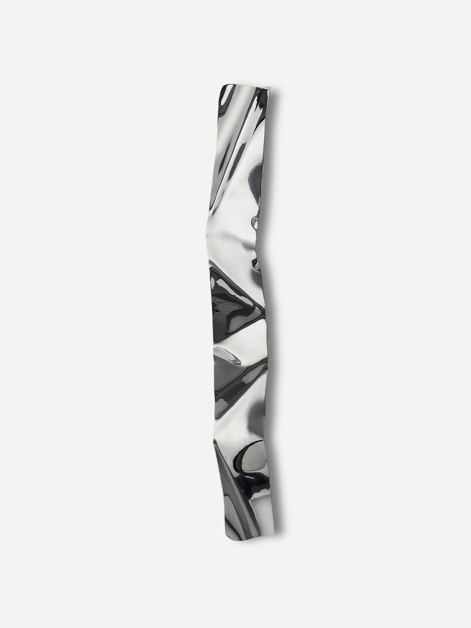 Close-up front view of the CRUNCH 5-foot door handle, highlighting its distinctive crunched texture. Crafted from stainless steel, this sculptural handle brings a modern, luxurious touch to any front entryway.