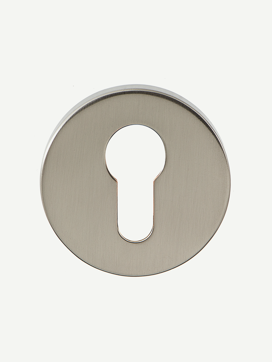 Image of the matching keyholes included with the RODULE Lever Handle set. The keyholes complement the handle’s sleek design, ensuring a cohesive look for modern interior doors.