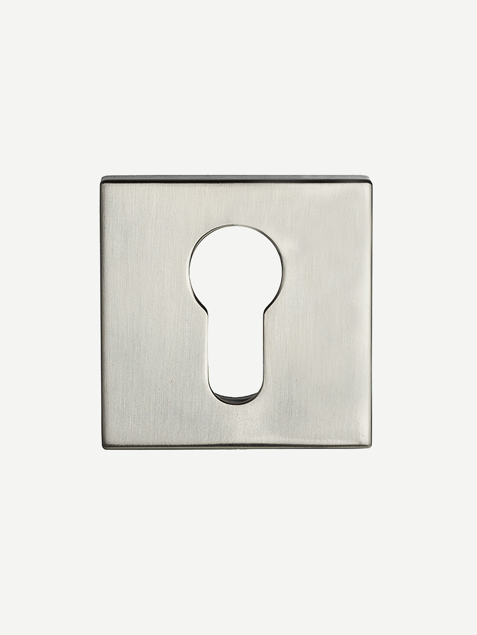 Close-up image of the matching keyhole escutcheon included with the FACETS Door Lever Handle set. The design complements the handle's luxurious aesthetic, offering both style and security.