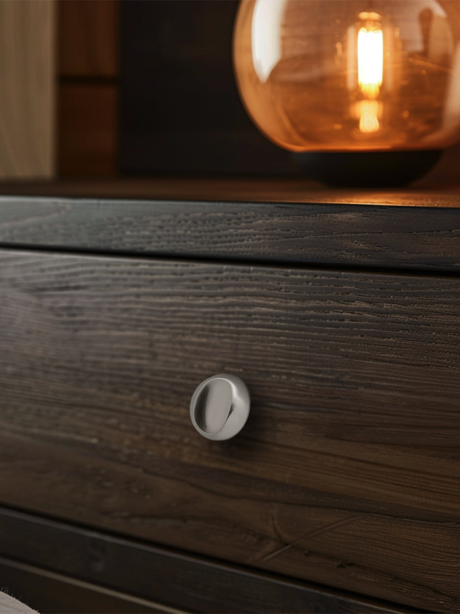 Mockup image of the Nebula knob installed on furniture, demonstrating its stylish impact and seamless integration into various spaces. Keywords: luxury drawer knob mockup, furniture hardware, modern interior design.