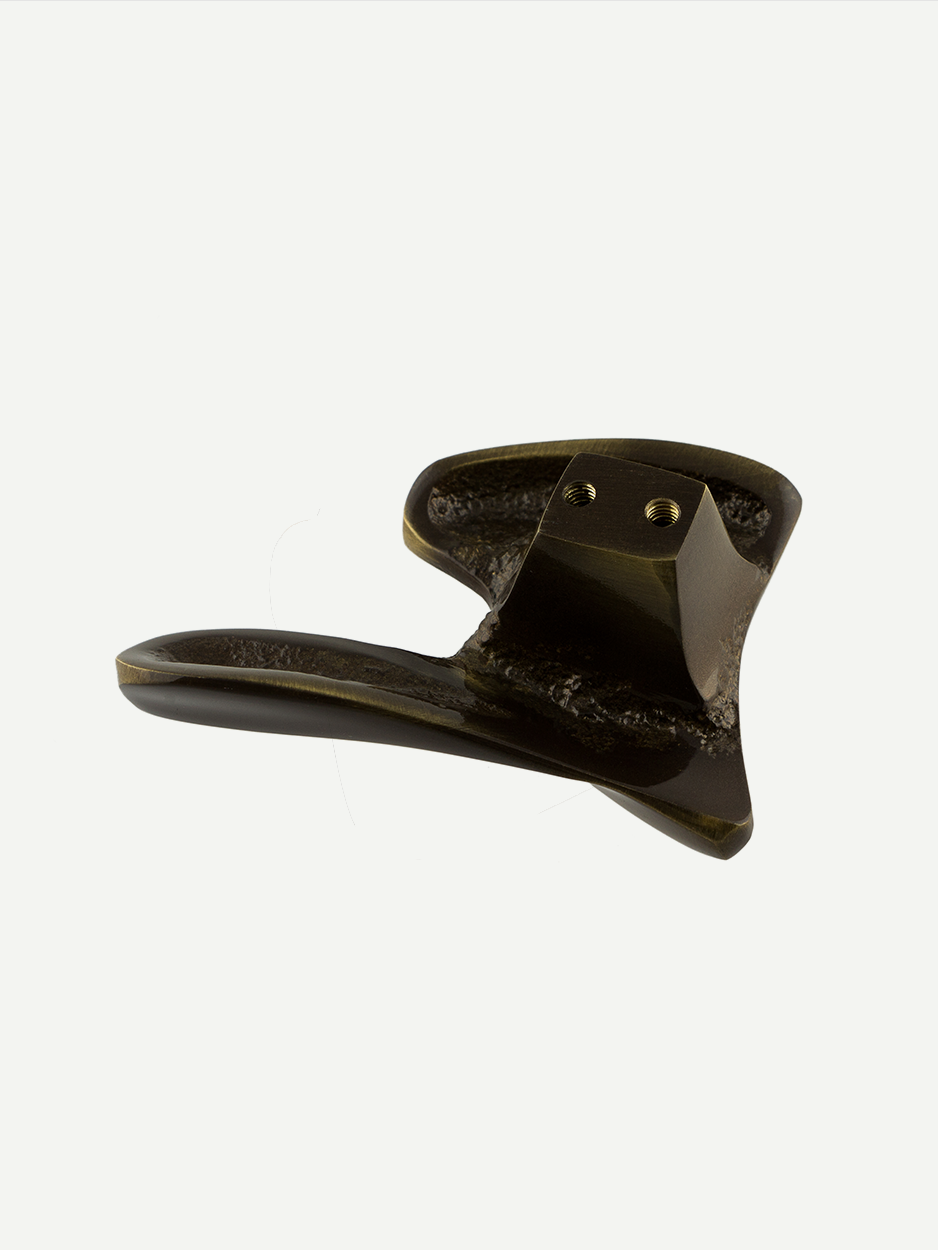 Custom brass cabinet pulls for bespoke kitchen interiors.