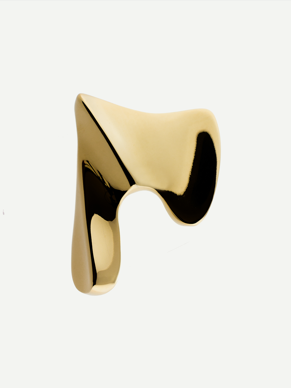 Designer bathroom vanity cabinet pulls in sculptural brass.