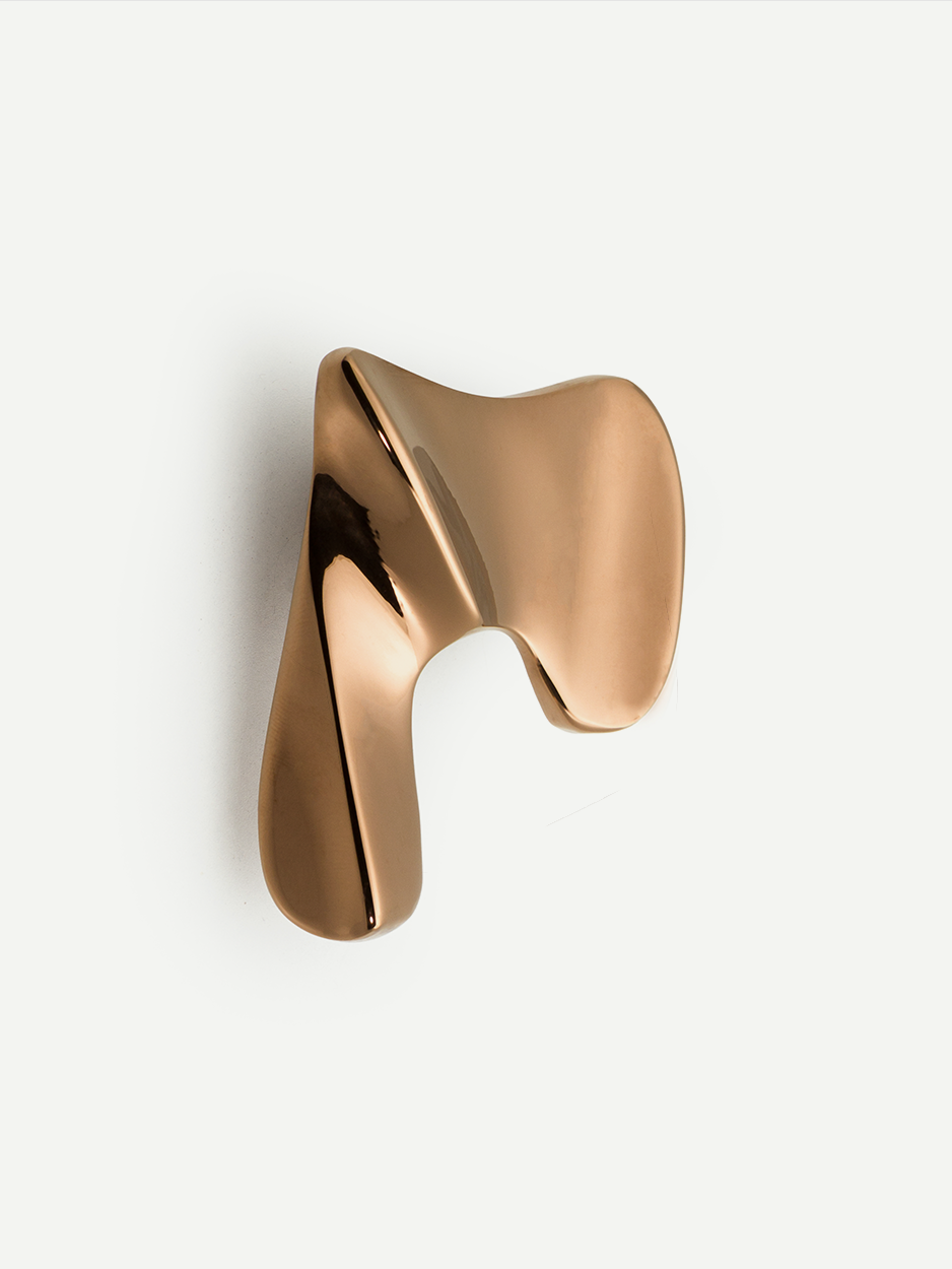 Statement pulls for luxury bathroom storage units in rose gold.