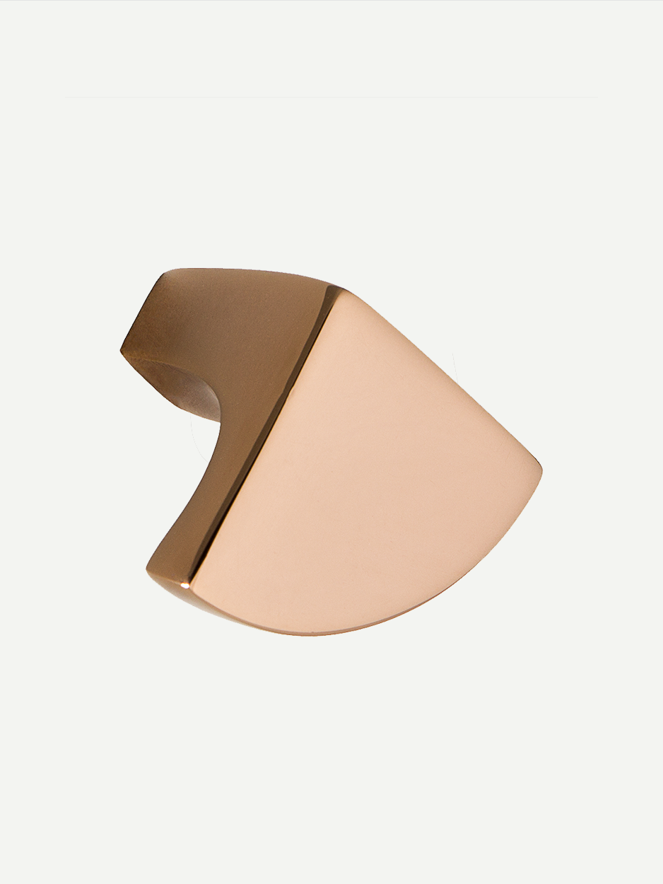 Sculptural brass knobs for high-end dresser drawers.