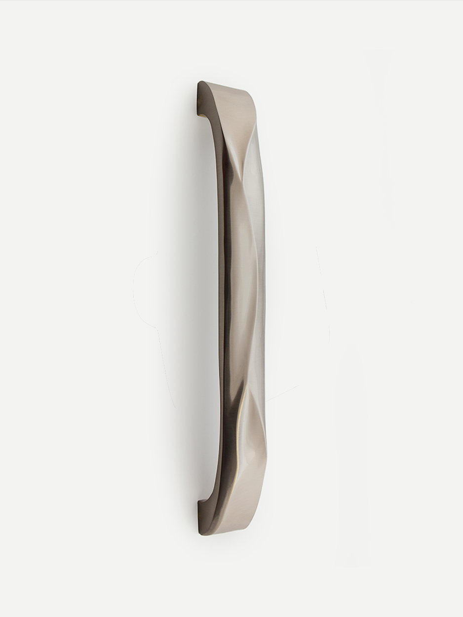 CHISEL front door handle in satin nickel finish, highlighting its elegant chiselled texture and smooth, luxurious appearance. This finish enhances the handle's contemporary and refined look.