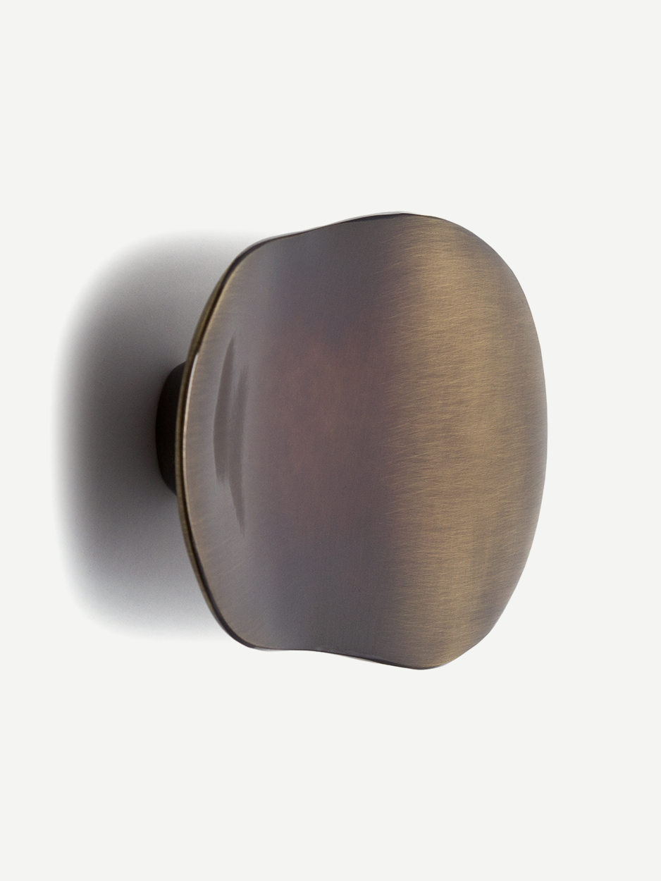 Luxury glossy bronze mushroom-shaped cabinet pull, organic curves, sleek design, enhance doors cabinets, high-end home decor, dune cabinet pull.