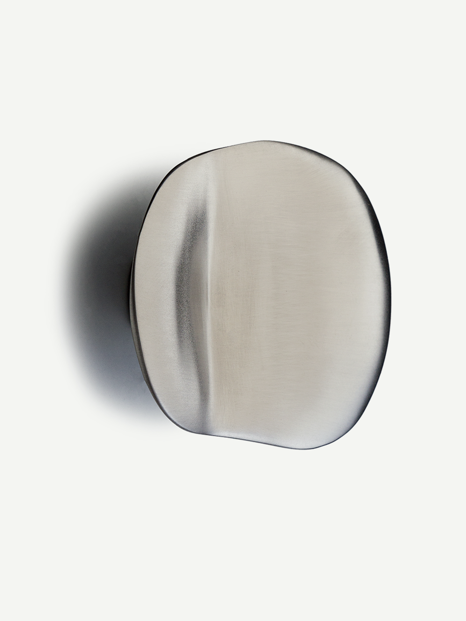 Satin nickel matte mushroom-shaped cabinet pull, undulating curves, luxurious feel, classy touch, modern home interiors.