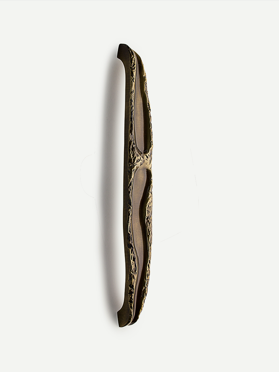 Close-up of the luxurious front door pull in a glossy bronze finish, showcasing its nature-inspired, abstract design that adds a sophisticated touch to any entrance.