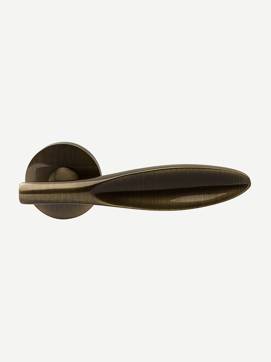 Image of the Ovoid Lever Handle in antique brass finish. The petal-shaped design adds a touch of whimsy and class, perfect for enhancing interior décor with a blend of luxury and character.