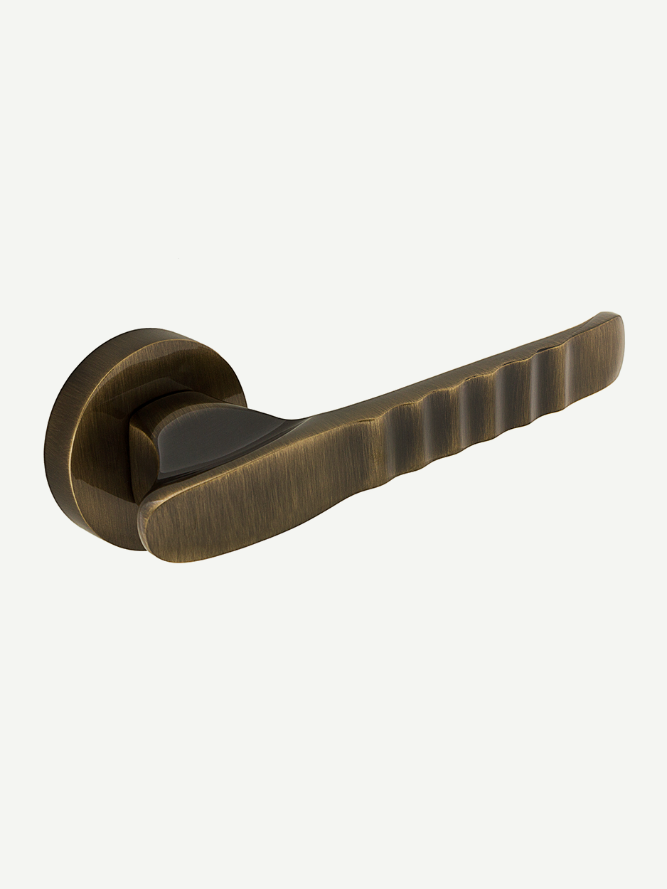 Luxury brass lever handle in a sculpted modern design