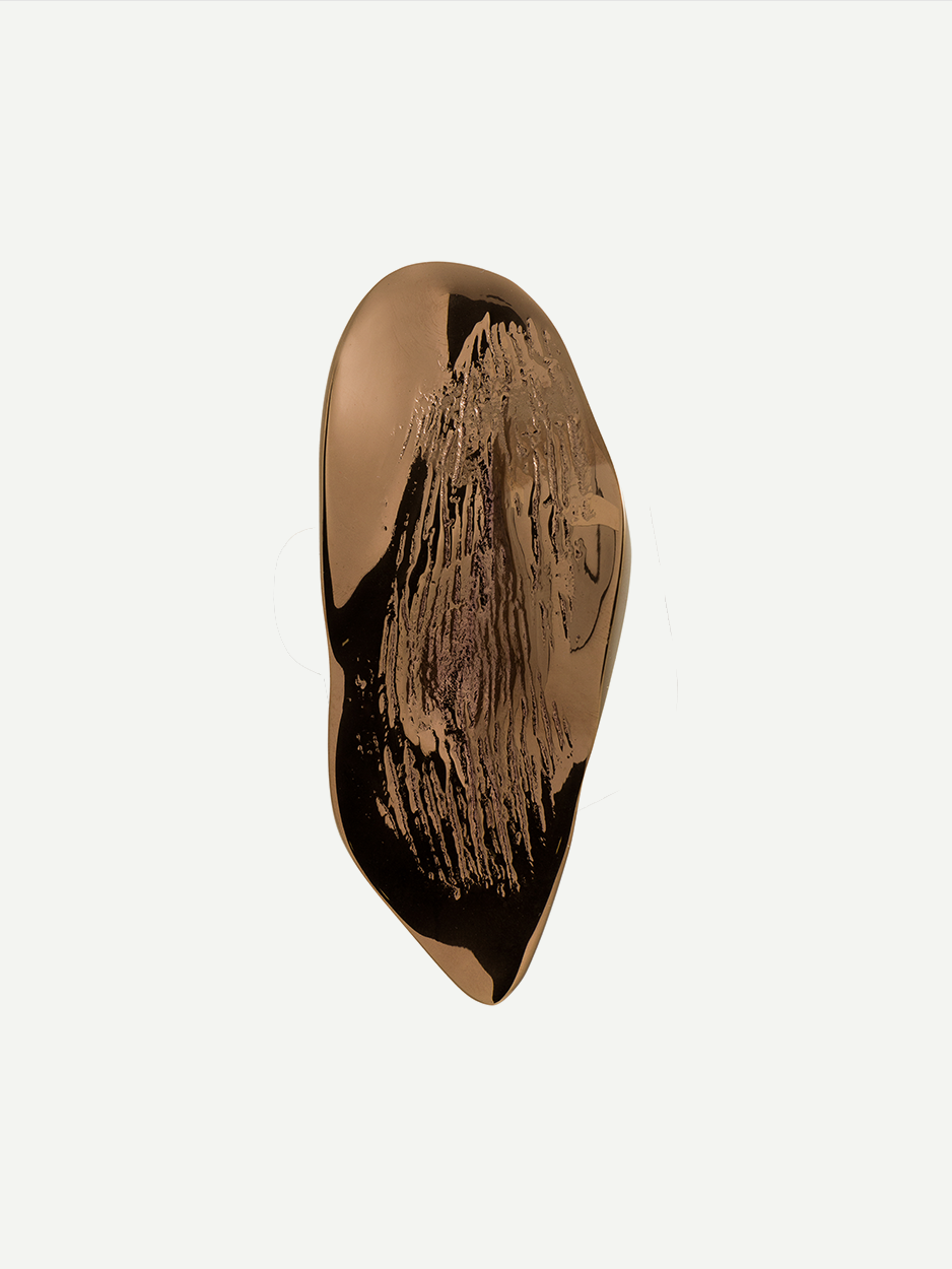 Textured cabinet and drawer pull in a Rose Gold PVD finish, designed to resemble a leaf and inspired by the natural shapes formed by lava. This luxurious, handcrafted pull brings elegance and tranquility to your home decor.