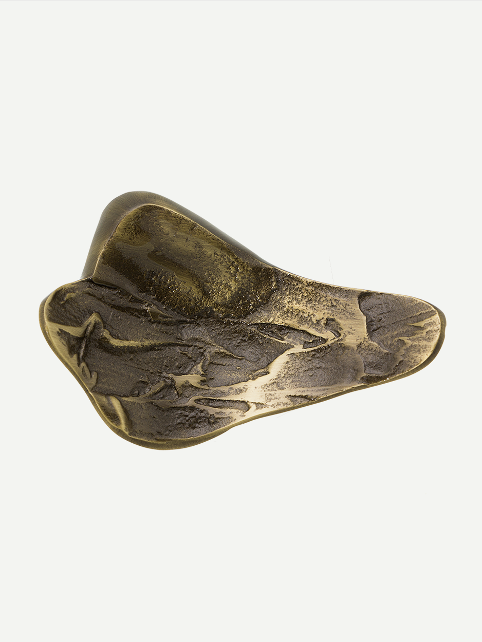 Modern brass pull handle for kitchen storage inspired by lava 