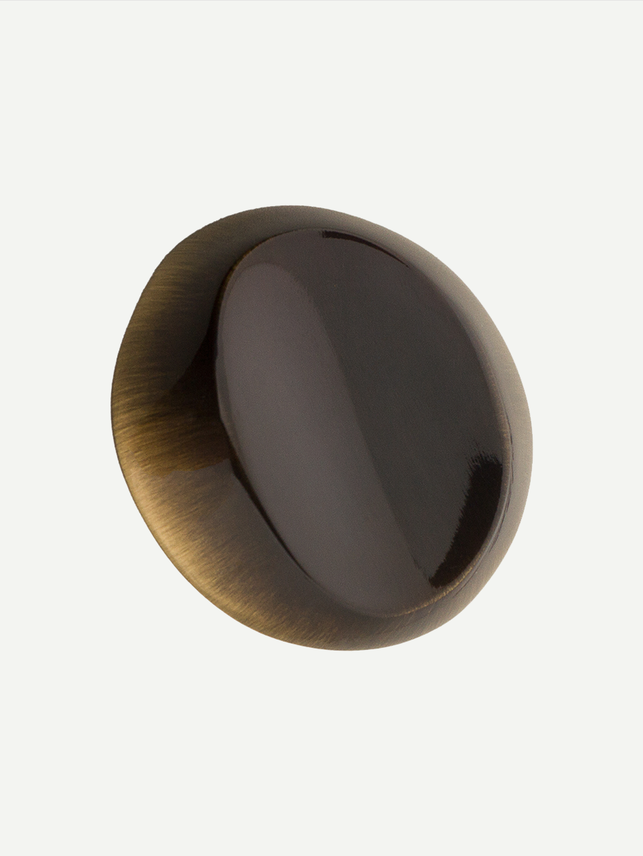 Image of the Nebula knob in a glossy bronze finish, showcasing its elegant and cloud-like shape. Keywords: glossy bronze cabinet knob, elegant hardware, cloud-shaped drawer handle.