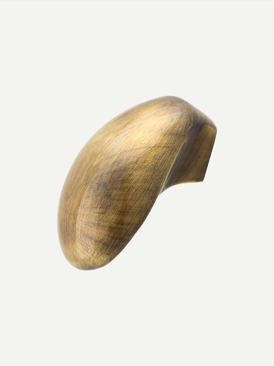 Sculptural brass knobs for high-end dresser drawers.