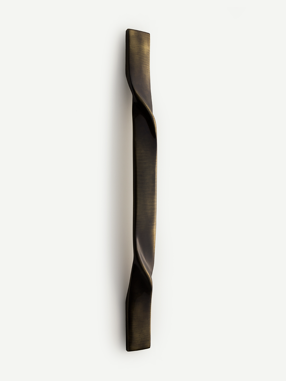Unique brass front door handle with artistic touch