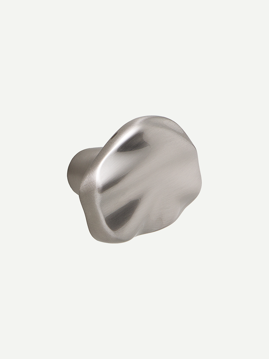 Image of the Supernova abstract cabinet knob in a satin nickel finish, highlighting its modern and sophisticated appearance. Keywords: satin nickel cabinet knob, abstract hardware, contemporary drawer handle.