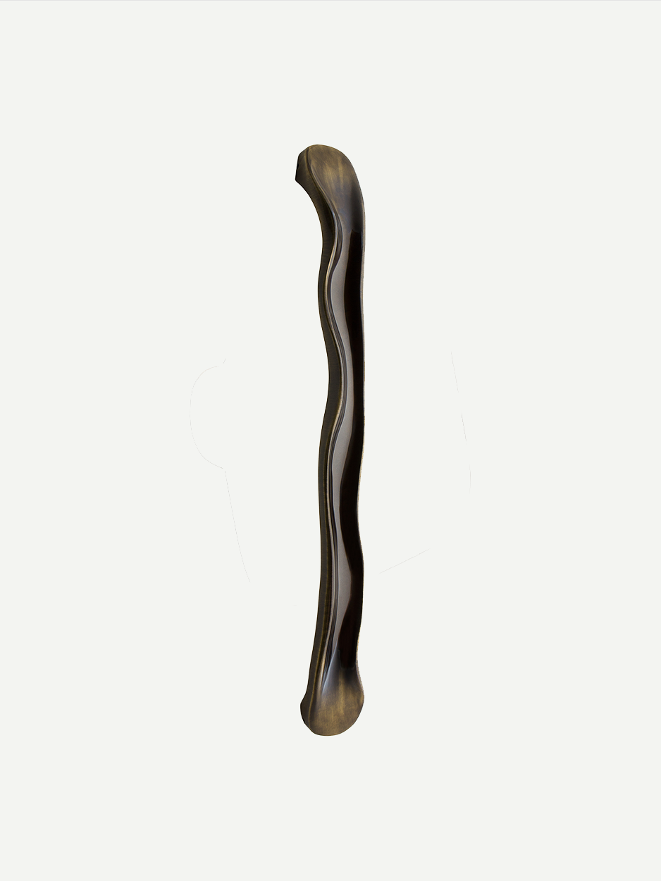 Minimal entry door pull in bronze finish.