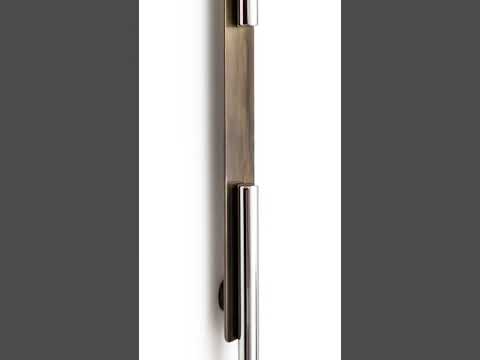 A video highlighting the Capsule main door pull handle in bronze-stainless steel finish, with a focus on its futuristic aesthetic as the camera moves over the handle’s details, perfect for high-end entryways.